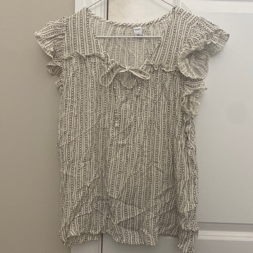 Off white sleeveless blouse with charcoal pattern